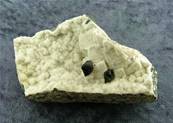 BLACK CALCITE CRYSTALS ON SHAMANITE DRUZE. SP7010