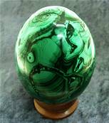 MALACHITE EGG WITH WOODEN DISPLAY STAND. SP8423POL