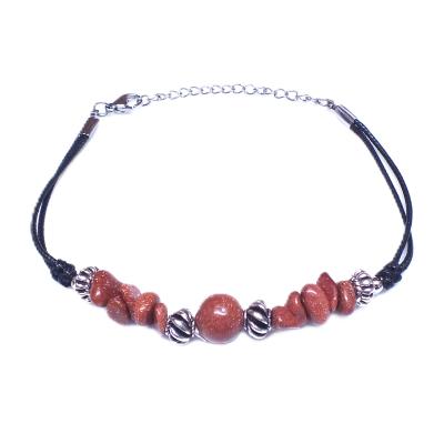 Chip & Bead Bracelet Featuring Copper Goldstone & Silver Plated Beads On A Black Cord.   SPR16980BR
