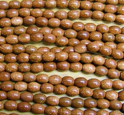 BROWN GOLD STONE RICE BEADS ON A STRING. SPR6031