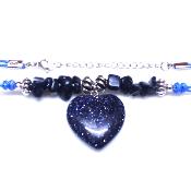 Chip & Bead Necklace Featuring Blue Goldstone & Silver Plated Beads And a Heart Pendant On Blue Cord.   SPR16981NEC