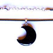 CRESCENT MOON PENDANT IN BLUE GOLDSTONE ON WAXED CORD.   SPR13970PEND