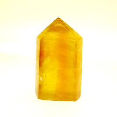 GEMSTONE POLISHED AND FACETED POINT IN DARK HONEY CALCITE.   SP13894POL